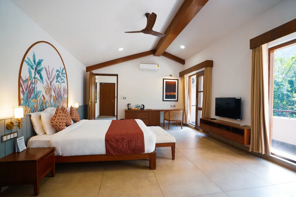 Cozy bedroom at The Creek Villa Jim Corbett with scenic views