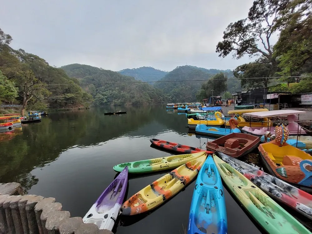 Kayaks and boats on Sattal Lake in Uttarakhand