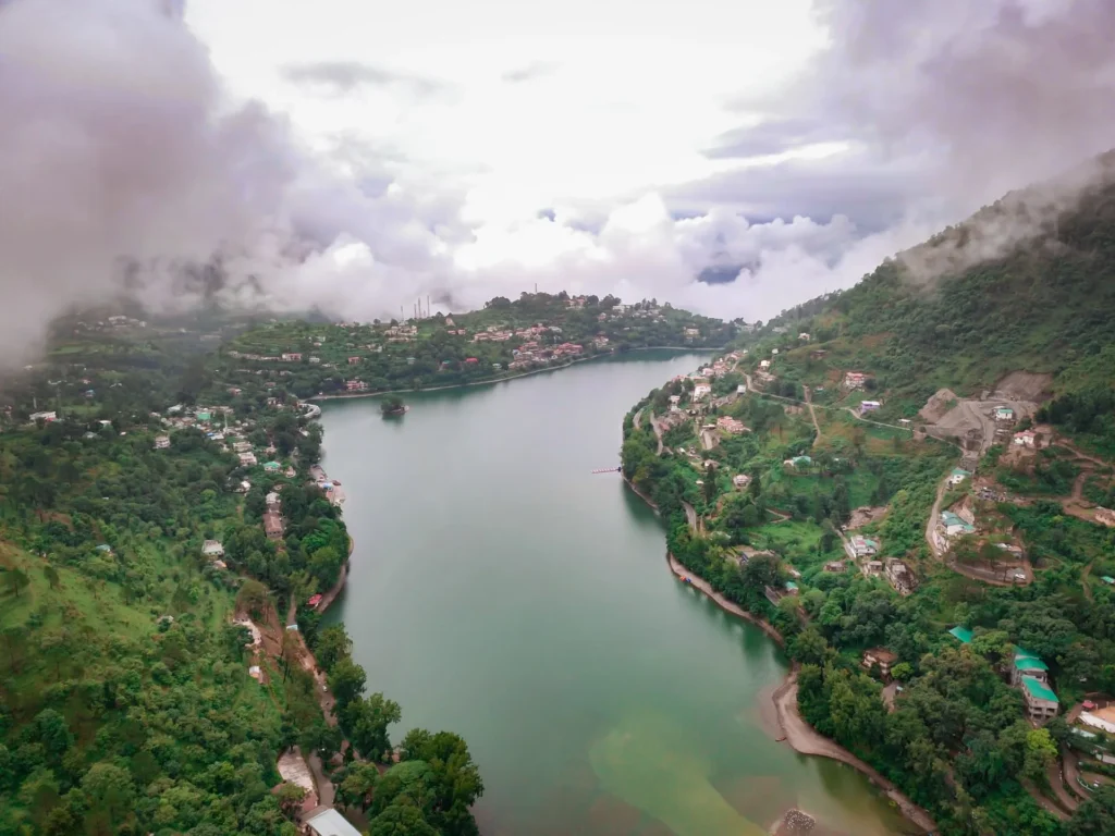 Scenic Bhimtal Lake surrounded by lush green hills during the monsoon